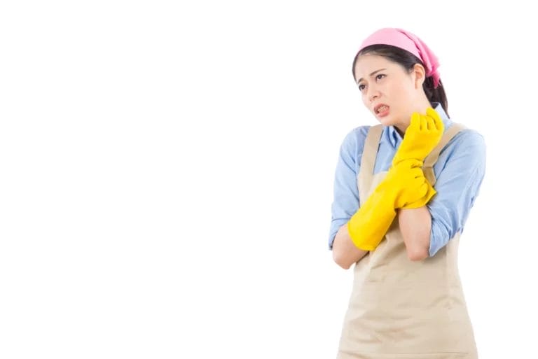 Woman holding her sprained wrist after an injury.