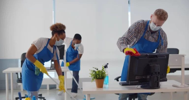 A cleaning company cleaning an office.