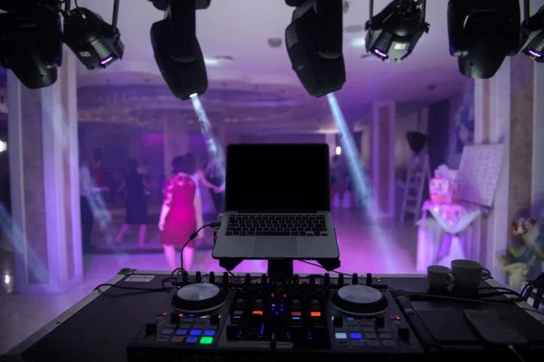 A DJ booth set up at a wedding venue.