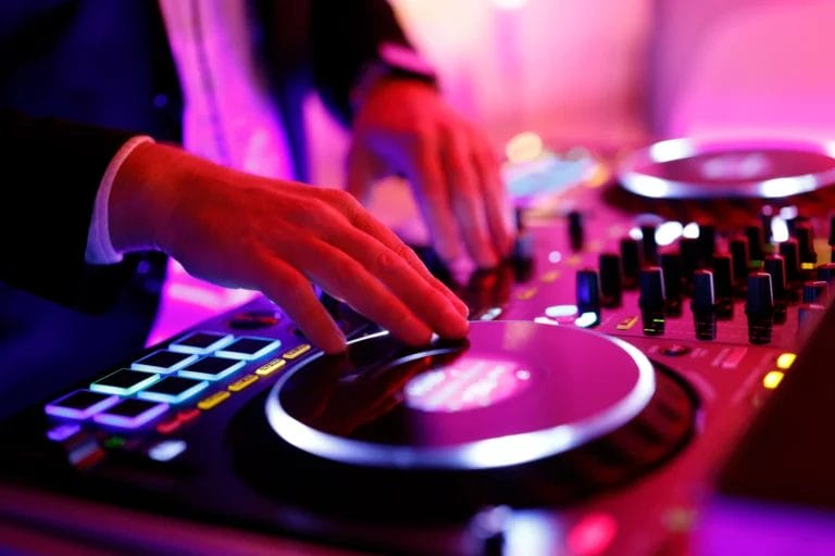 A wedding DJ mixing tracks.