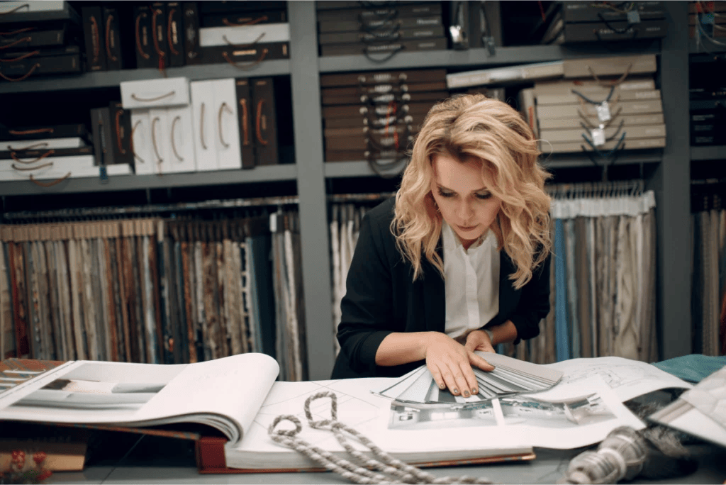 Interior designer comparing paint chips in a design studio