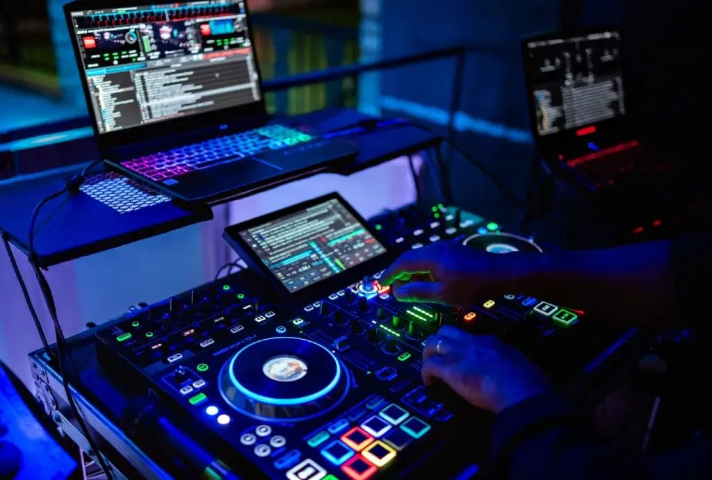 A wedding DJ booth in the dark.