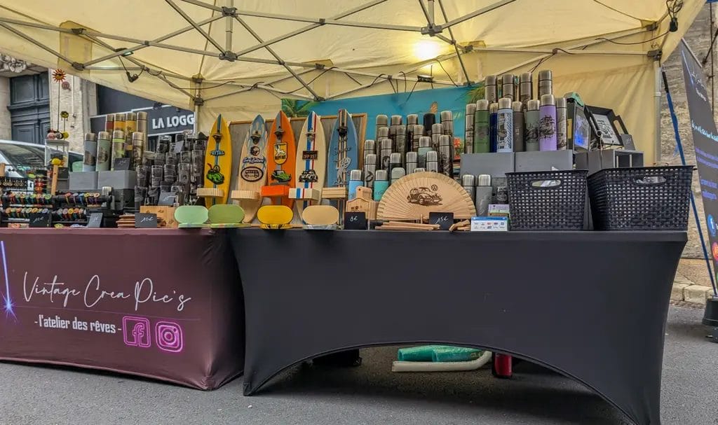 A vendor's 10x10 booth display at an outdoor street market.
