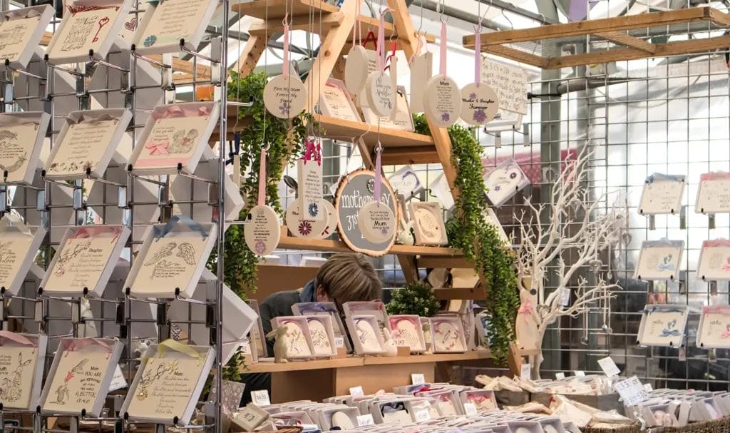 A look at a vendor's handmade items on display in her booth at an indoor craft fair.