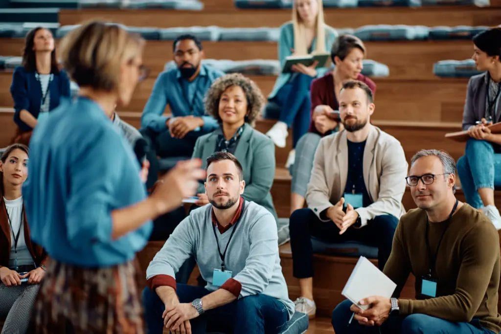 Audience at a business seminar listen to the speaker
