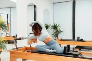 Woman stretching on pilates machine